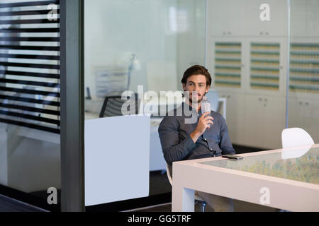 Young man drinking water from a bottle Stock Photo