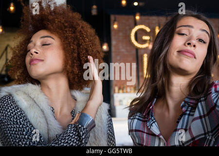 Portrait of happy female friends having fun in cafe Stock Photo