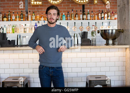 Bartender Standing at Bar Counter, Cleaning Glasses with Towel Stock Photo  - Image of portrait, informal: 190411966