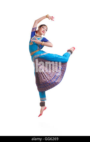 Full length of dancer performing Bharatanatyam against white background Stock Photo