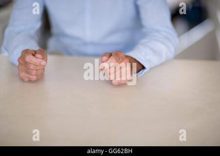 Mid section view of a senior man sitting Stock Photo