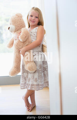 Portrait of a cute girl holding teddy bear Stock Photo