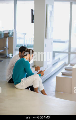 Two male friends using a digital tablet Stock Photo