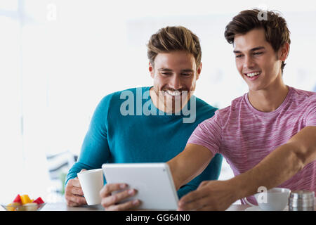 Close-up of two happy young men taking selfie with a digital tablet Stock Photo
