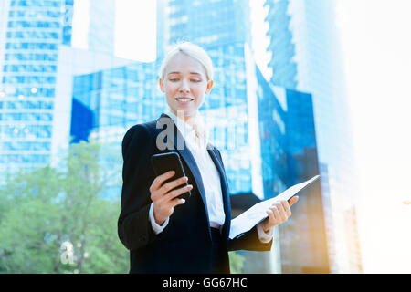 Portrait of a Businesswoman using a smartphone Stock Photo