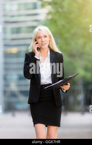 Businesswoman using a mobile phone Stock Photo