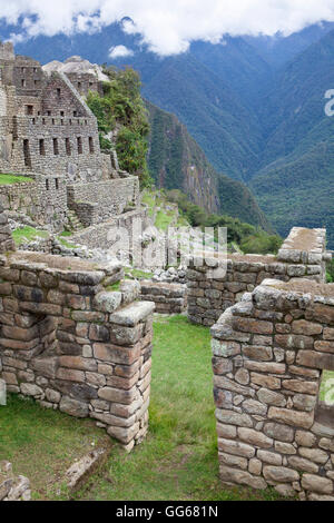 View of Inca stone houses at Machu Picchu in Peru Stock Photo