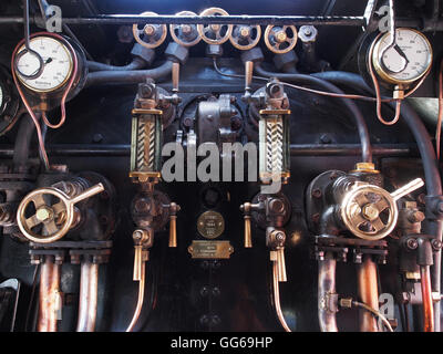 Controls and guages in the driving cab of the 60103 Flying Scotsman steam engine. Stock Photo