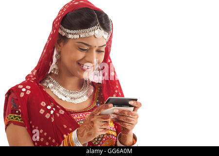 Female dandiya dancer reading an sms Stock Photo - Alamy