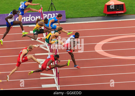 Competitors in Men's 110m hurdles semi-final clear hurdles, London 2012 Stadium, Summer Olympic Games, London, England, UK Stock Photo