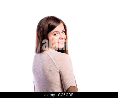 Girl in brown sweater, young woman, studio shot Stock Photo