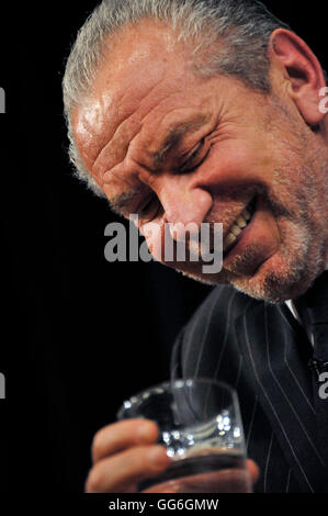 Lord Alan Sugar ....the many mainly despairing faces of the govts Enterprise Champion' at British Library event. Stock Photo