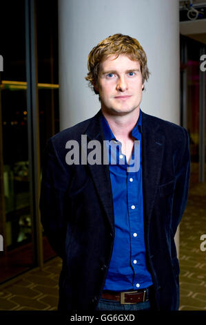 Picture By: Nick Cunard / Retna Pictures - Tristram Hunt, British historian, broadcaster and newspaper columnist. In 'The Frock-Coated Communist'  Tristram Hunt reveals Engels' contradictory character, a Victorian bon-viveur who scrutinised the lives of the workers in Manchester, research that became The Condition of The Working Class in England a brutal indictment of capitalism which rings true today. 11th November 2009. Nick pictured Southbank Centre in London. -  78692  NCD - *World Rights* Stock Photo