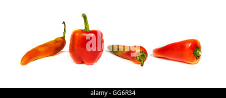 four red peppers of different shapes on white background Stock Photo