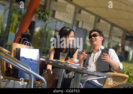 Young adult couple having brunch at a retail outlet. England. UK Stock Photo