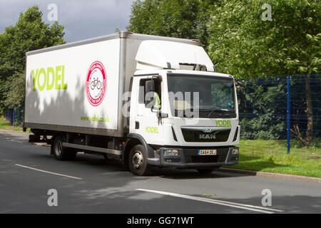 Yodel delivery driver and vehicle en-route in Preston, Lancashire, UK Stock Photo