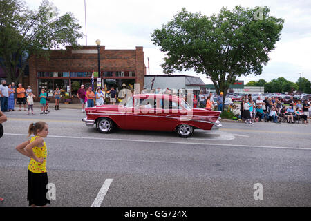 A 1957 Chevrolet 2-door sedan participates in the 2016 Annual Cruz In Parade in Montague, Michigan. Stock Photo