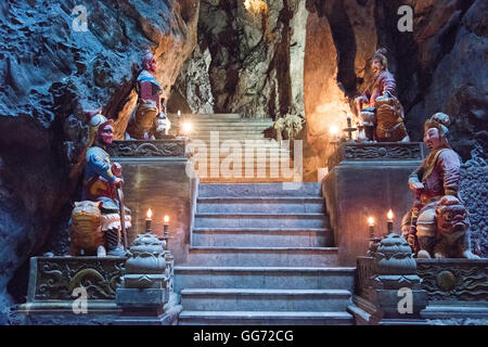 Guardian statues on the entrance staircase to Huyen Khong Cave in the Marble Mountains, near Da Nang. Stock Photo