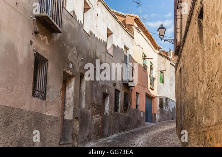 Curved steep street in old Toledo, Spain. Stock Photo