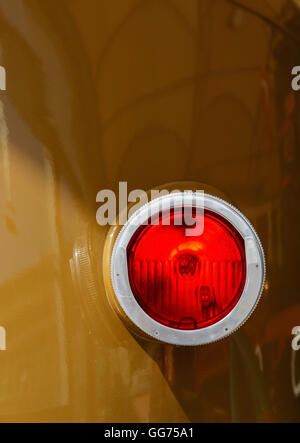 Big locomotive reflector with light bulb on the sidewall. Stock Photo