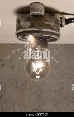 Light bulb in an electric circuit in a school science lab with students ...
