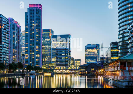 Illuminated building in Canary Wharf, financial hub in London at evening Stock Photo