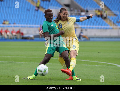 South Africa's Noko Matlou and Sweden's Lotta Schelin in action during the Women's First Round - Group E match at the Olympic Stadium, Brazil. Stock Photo