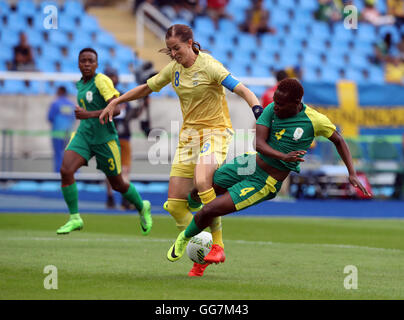 South Africa's Noko Matlou and Sweden's Lotta Schelin in action during the Women's First Round - Group E match at the Olympic Stadium, Brazill. Stock Photo