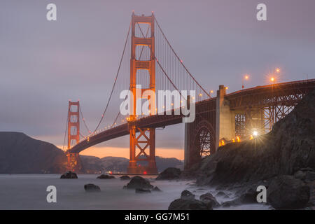 Crack in the clouds behind the Golden Gate Bridge as seen from Marshall's Beach. Stock Photo