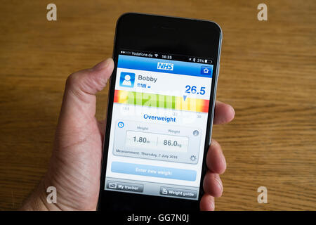 Smart phone app for measuring BMI body mass index to determine if one is overweight or not Stock Photo