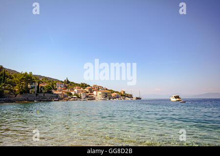 Cres Island, Croatia: View to the village Valun with harbor and boats in the evening sun Stock Photo