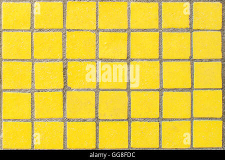 closeup of old yellow dirty mosaic with grey lines Stock Photo