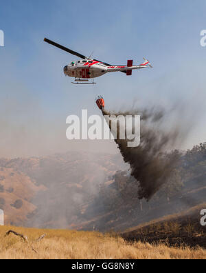 Diablo Grande, CA, USA. 3rd Aug, 2016. CalFire tanker 83 flies into a ...