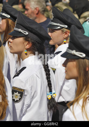 Kiev, Ukraine. 4th Aug, 2016. Ukrainian female Police officers, wearing earrings in the colour of the Ukrainian national flag, stand in line during an official ceremony dedicated to the celebration the Day of the National Police of Ukraine on St. Sophia Square in Kiev, on 04 August, 2016. © Serg Glovny/ZUMA Wire/Alamy Live News Stock Photo