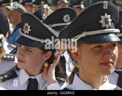 Kiev, Ukraine. 4th Aug, 2016. Ukrainian female Police officers, wearing earrings in the colour of the Ukrainian national flag, stand in line during an official ceremony dedicated to the celebration the Day of the National Police of Ukraine on St. Sophia Square in Kiev, on 04 August, 2016. © Serg Glovny/ZUMA Wire/Alamy Live News Stock Photo
