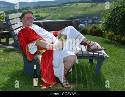 Kesten, Germany. 9th Aug, 2016. Sven Finke posing in a vineyard near Kesten, Germany, 9 August 2016. The law student was crowned wine king on 12 August 2016. For two years, the 25-year-old will campaign for the wine of the 350-people-village dressed as 'Bacchus', the Roman god of wine. PHOTO: HARALD TITTEL/dpa/Alamy Live News Stock Photo