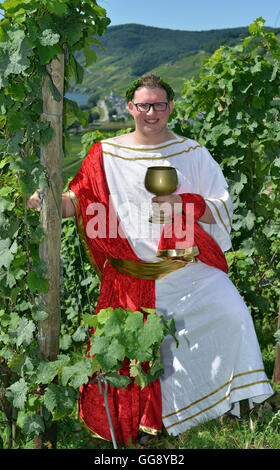 Kesten, Germany. 9th Aug, 2016. Sven Finke posing in a vineyard near Kesten, Germany, 9 August 2016. The law student was crowned wine king on 12 August 2016. For two years, the 25-year-old will campaign for the wine of the 350-people-village dressed as 'Bacchus', the Roman god of wine. PHOTO: HARALD TITTEL/dpa/Alamy Live News Stock Photo