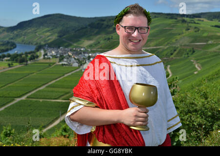 Kesten, Germany. 9th Aug, 2016. Sven Finke posing in a vineyard near Kesten, Germany, 9 August 2016. The law student was crowned wine king on 12 August 2016. For two years, the 25-year-old will campaign for the wine of the 350-people-village dressed as 'Bacchus', the Roman god of wine. PHOTO: HARALD TITTEL/dpa/Alamy Live News Stock Photo