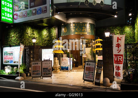 Anshin Oyado luxury capsule hotel located within 3-minutes of the busy Shinjuku station on August 7, 2016, Tokyo, Japan. The new take on the traditional Japanese capsule hotel offers larger capsules, free artificial hot springs & mist sauna, internet cafe and Wi-Fi. This hotel is male only and rates start at 5480 yen (54USD). Each of the hotel's 256 capsules is equipped with fire alarm, air conditioner, tablet computer and flat-screen TV. Public areas such as the hot springs bath, laundromat, clothing shop and snack and drinks vending machines are open 24 hours. The hotel's website is in Chine Stock Photo