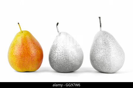 Close up of three forelle pears in a row with selective color, one in color and the others in black and white. Stock Photo