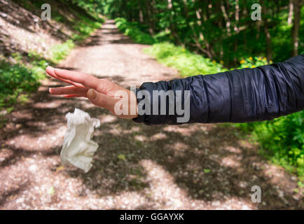 A polluting person in an untouched nature. Stock Photo