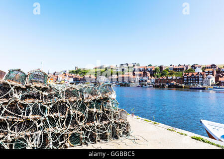 Lobster pots on harbour wall Whitby Town North Yorkshire harbor coastal fishing port ports Coast UK England Stock Photo