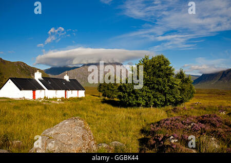 Black Rock cottage in foreground and Buchaille Etive Mor in background Lochaber Scotland UK Stock Photo