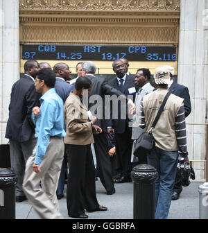 New York Wall Street visitors during the break outdoors Stock Photo