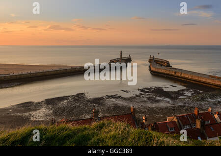 View of the entrance to the Whitby harbour with lighthouses on the East and West Piers and beacons on the pier extensions Stock Photo