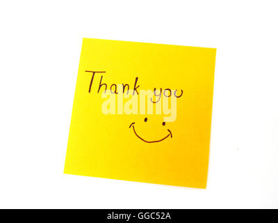 Writting 'Thank you' on post it note for someone Stock Photo