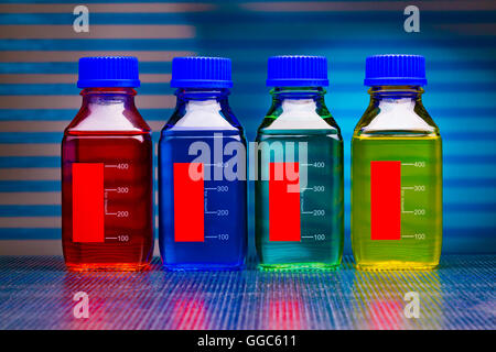 colored liquid in glass bottles Stock Photo