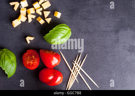 Marinated fillet with tomato heart shaped.  Appetizer for a party. Valentine's Day treat for your loved one. Stock Photo