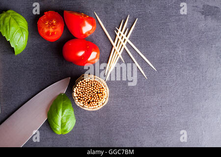 Marinated fillet with tomato heart shaped.  Appetizer for a party. Valentine's Day treat for your loved one. Stock Photo