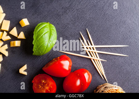 Marinated fillet with tomato heart shaped.  Appetizer for a party. Valentine's Day treat for your loved one. Stock Photo